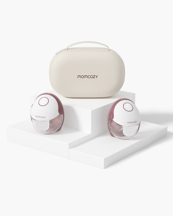 Momcozy M6 hands-free breast pump set in carrying case, white and pink design.