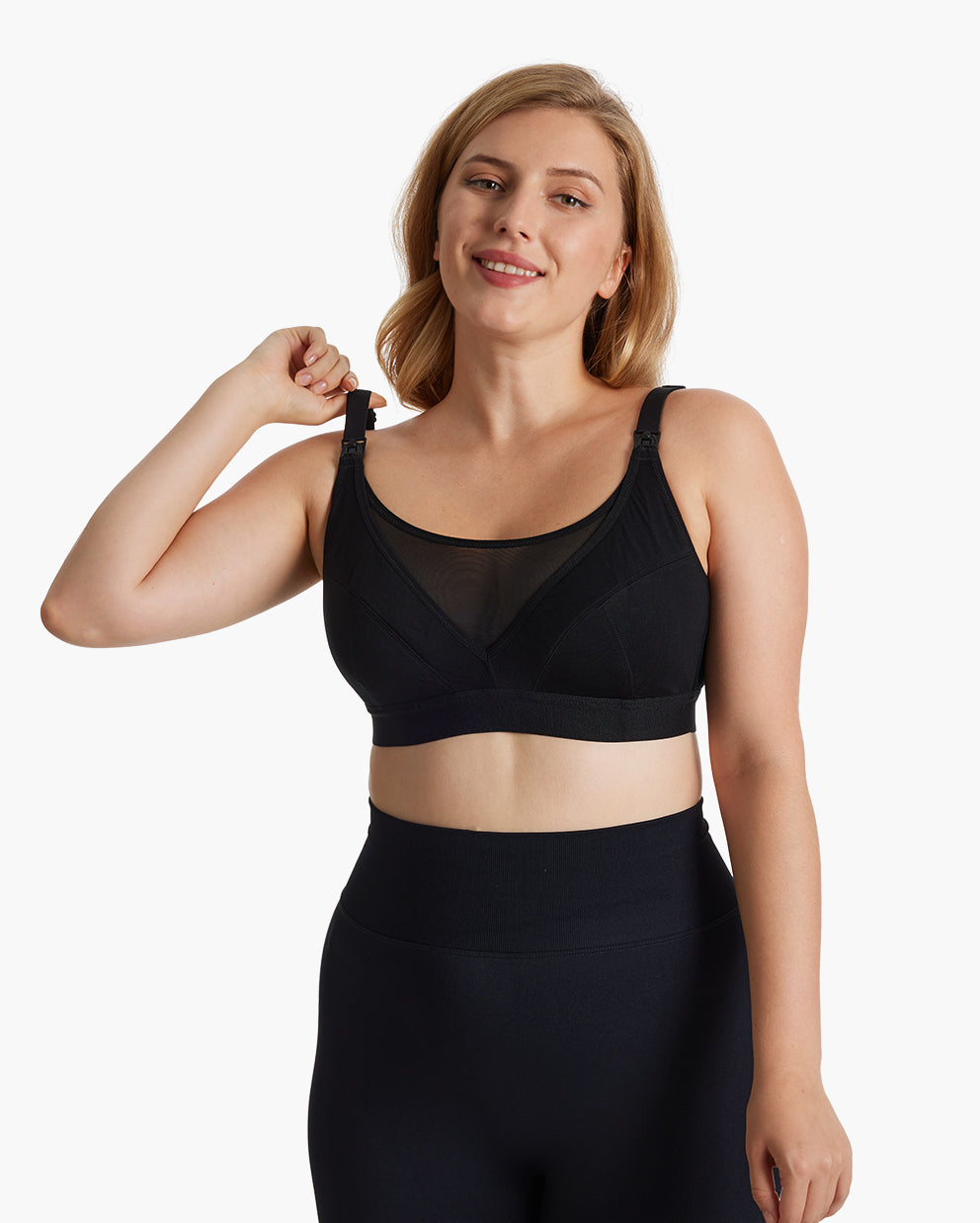 Woman wearing the Momcozy Bamboo Ultra-Soft & Cool Breeze Pumping & Nursing Bra (HF018) in black, showcasing the comfortable and supportive design for pumping and nursing mothers.