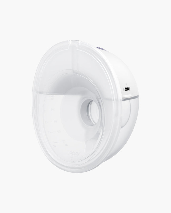 Close-up view of the All-in-one M5 Wearable Breast Pump highlighting its transparent design and measurement lines