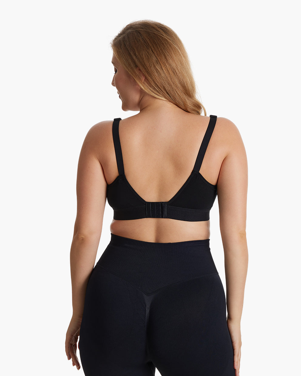 Woman wearing black bamboo ultra-soft and cool breeze pumping and nursing bra HF018, shown from the back with adjustable straps and hook-and-eye closure.