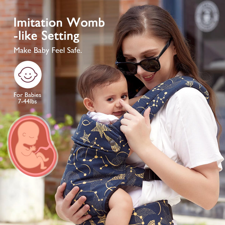 Mother carrying baby in Momcozy baby carrier Starry Night color, suitable for babies 7-44lbs, imitation womb-like setting for baby safety