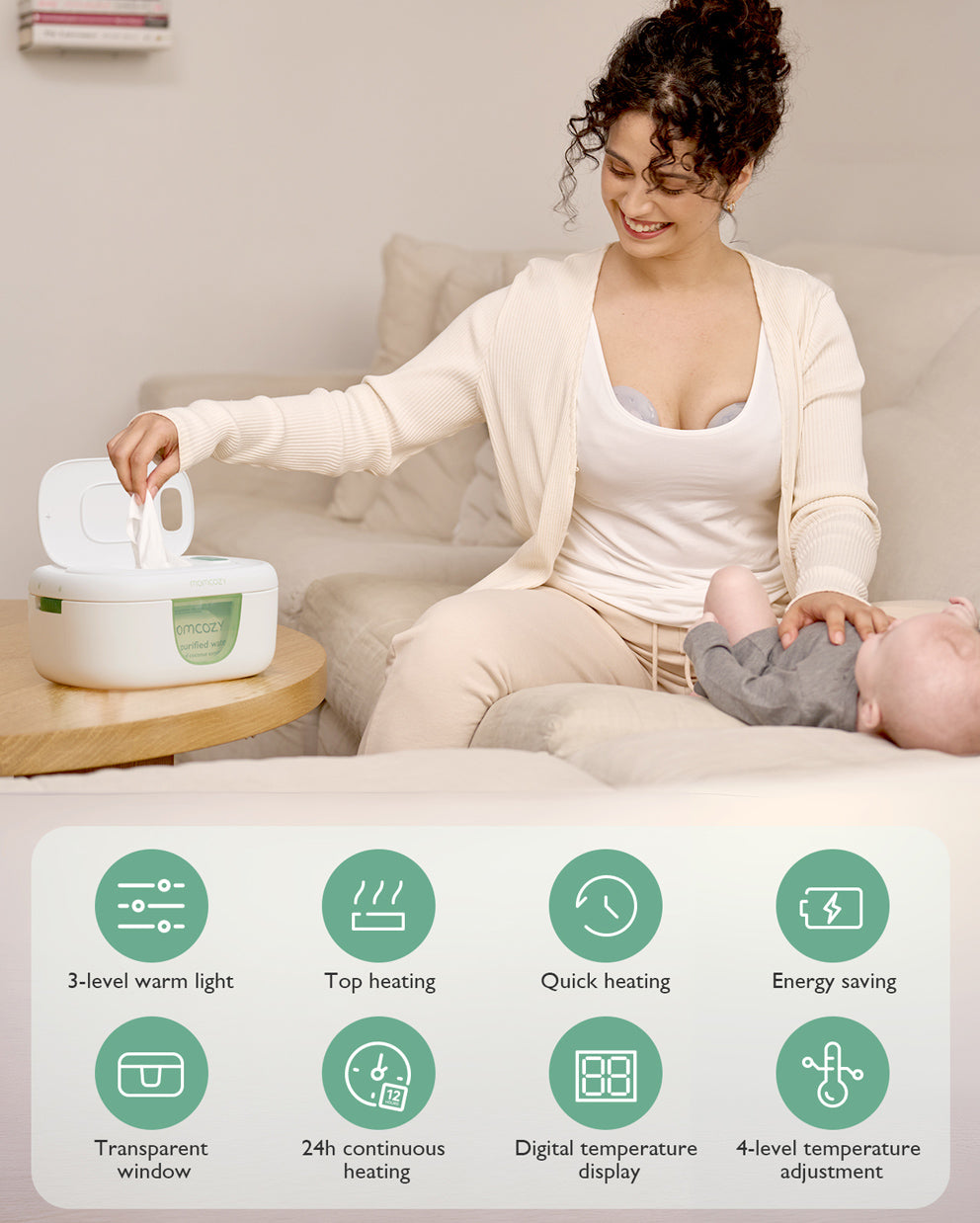 Momcozy baby wipe warmer with digital display, being used by a mother with baby.