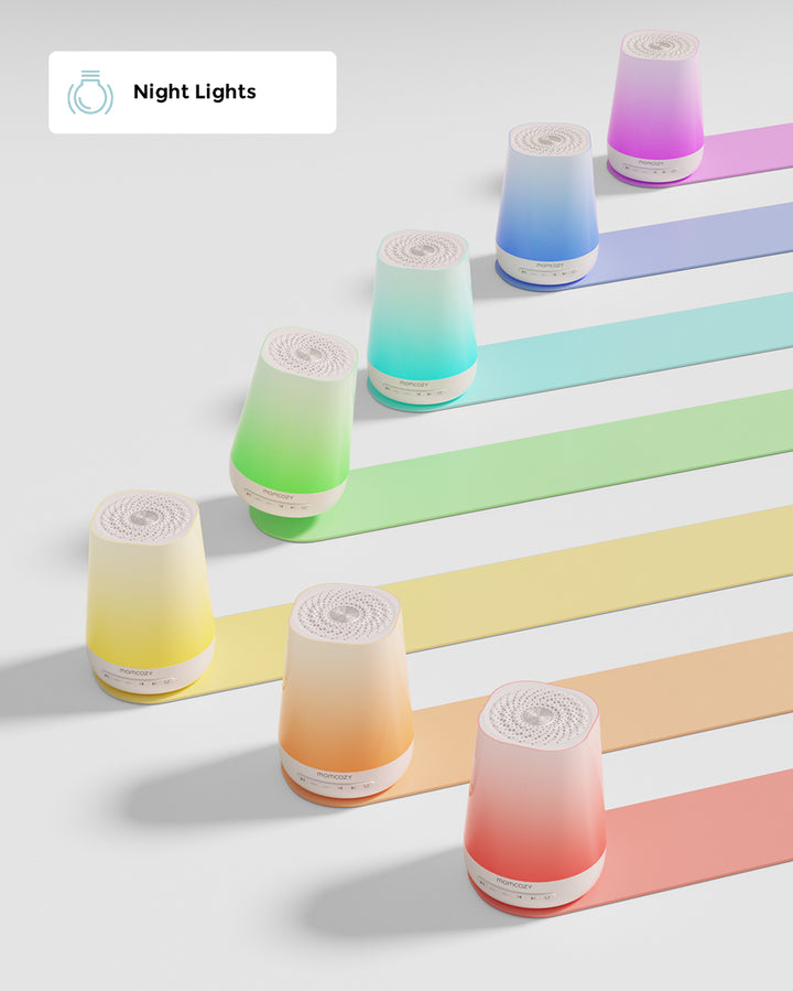 Eight smart baby night lights in an array of colors placed diagonally on matching colored stripes, promoting soothing nighttime ambiance for babies.