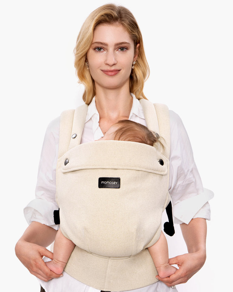 Translation missing: en.Momcozy PureHug baby carrier in beige, comfortable babywearing for mother and baby, promotes bonding