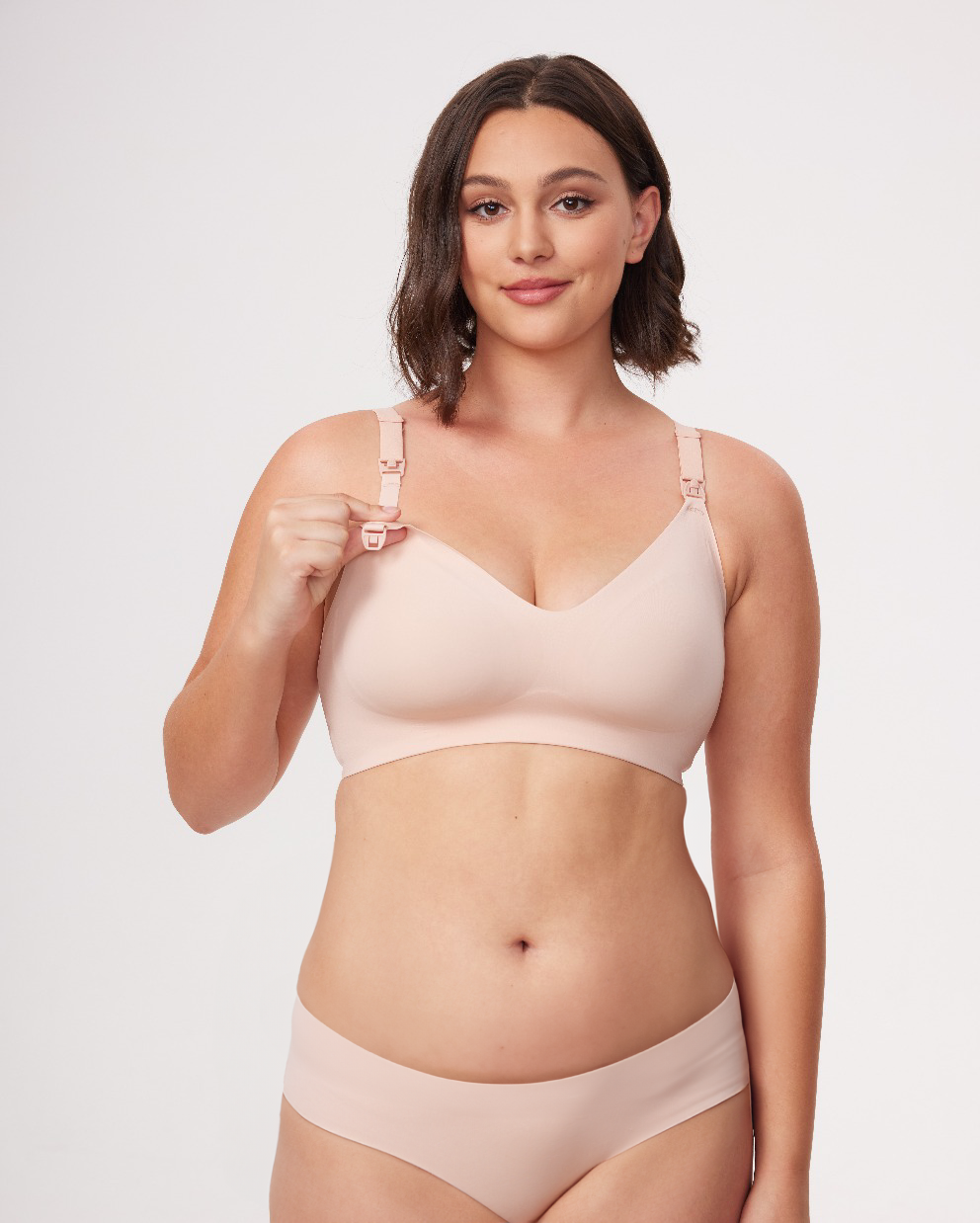 Model in light taupe Ultra Soft Seamless Nursing Bra YN21, showing easy-release clip for functional nursing and M5 pump use.